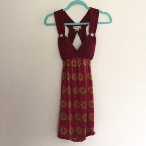 Soft open back dress with wood detail!